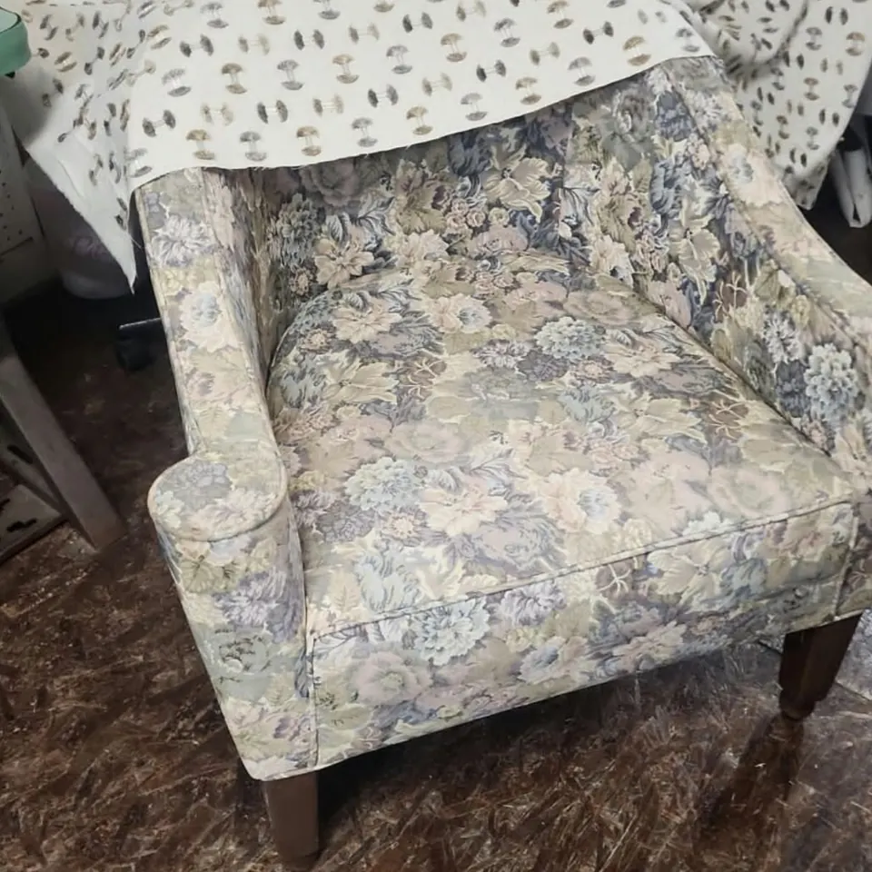 Floral armchair before reupholstery