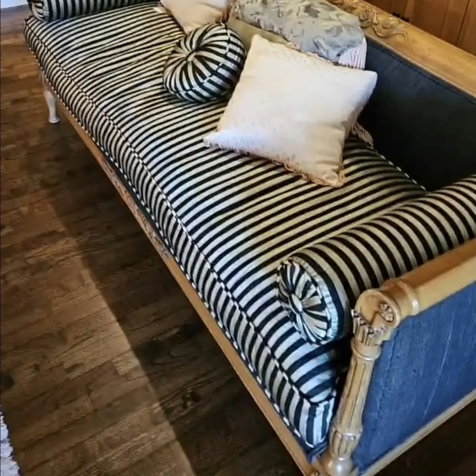 Striped antique settee before reupholstery