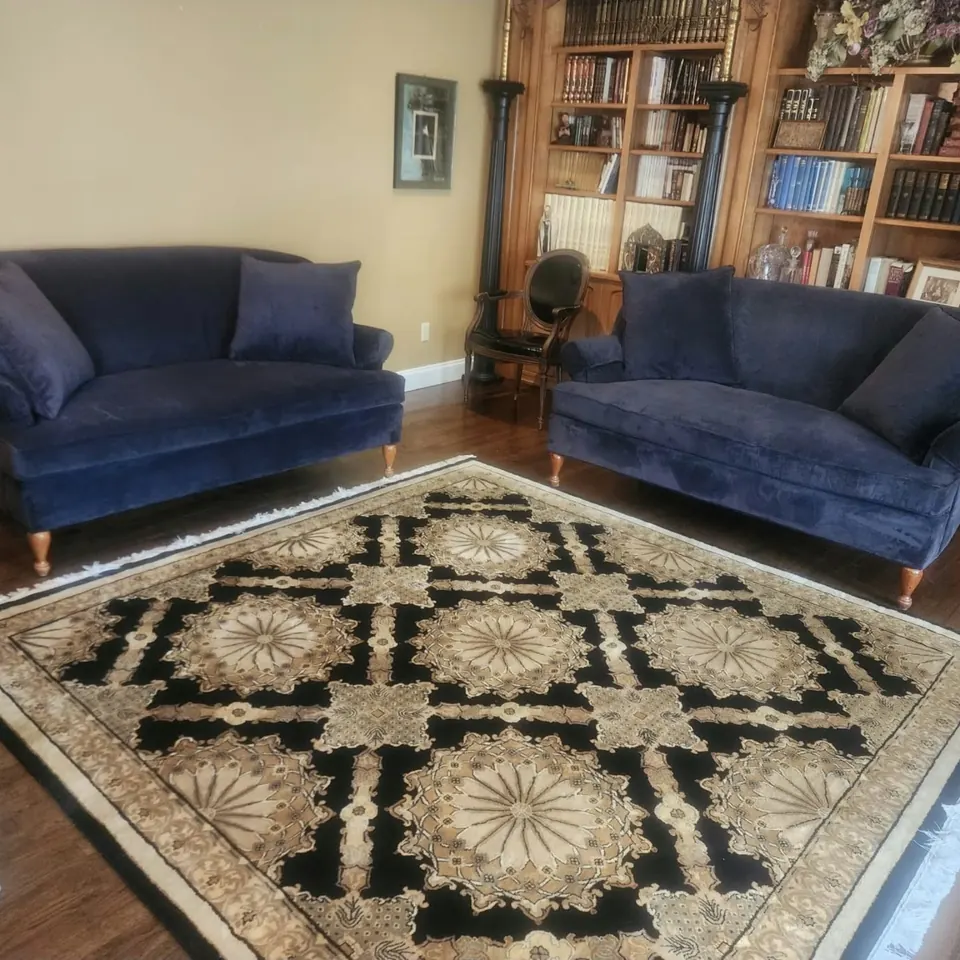 The same sofa and loveseat reupholstered in navy velvet by Elegant Window Fashion