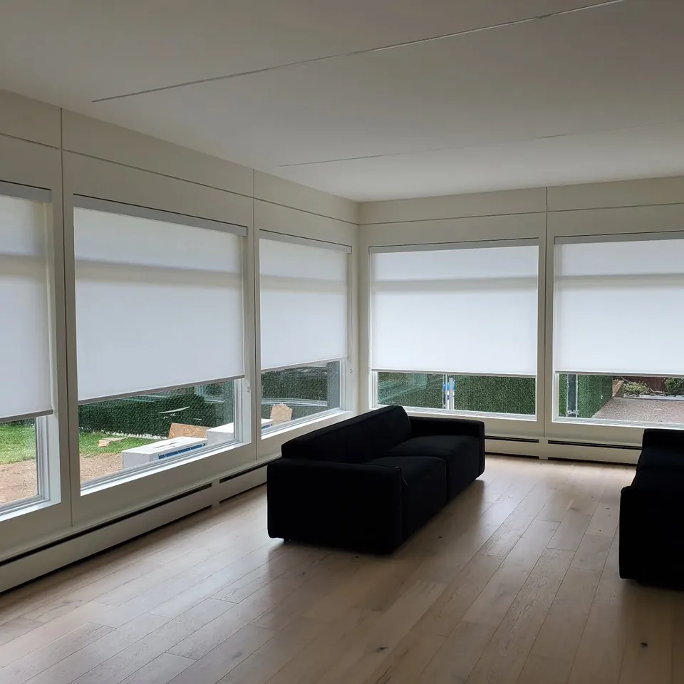 Roller shades, corner windows by Elegant Window Fashion