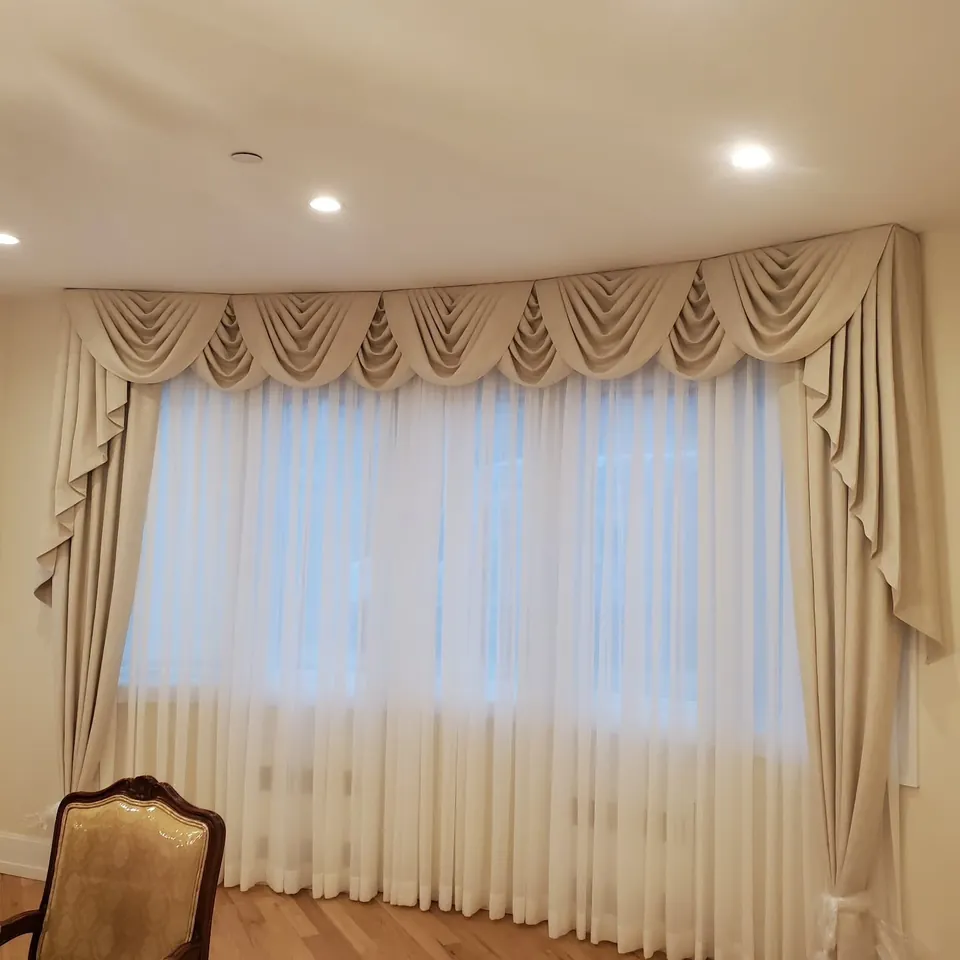 Swag valance over sheers by Elegant Window Fashion