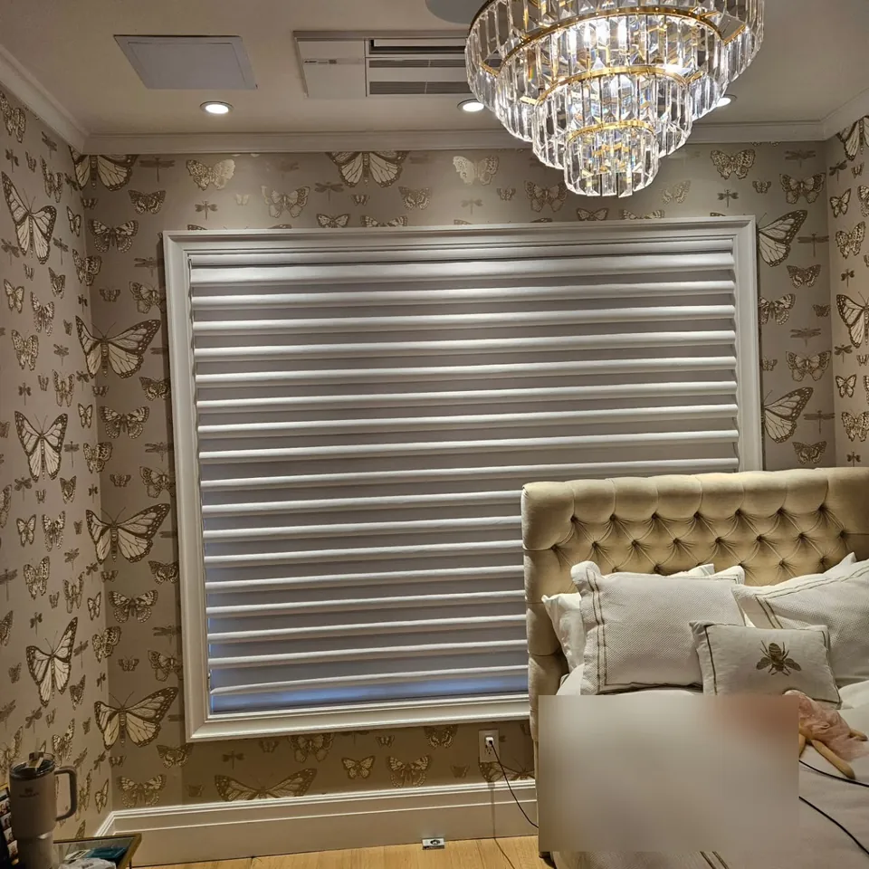 Tufted headboard and banded shade by Elegant Window Fashion