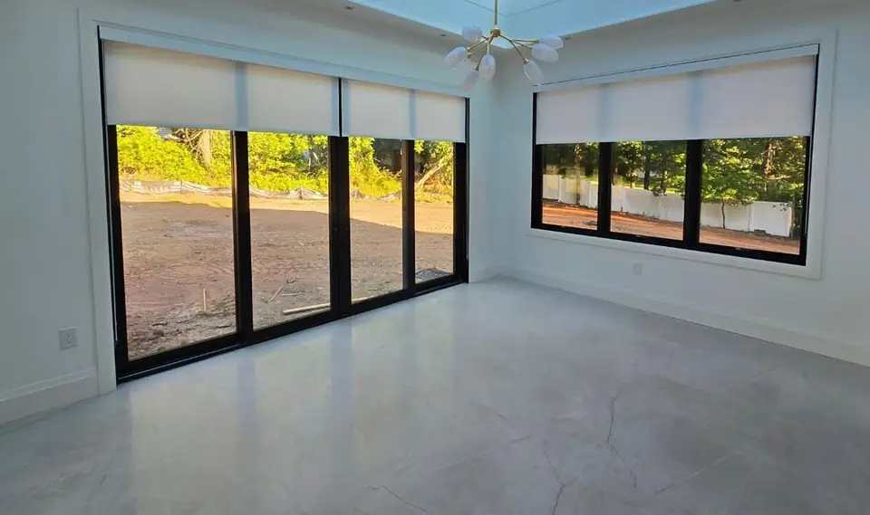 Roller shades, sunroom by Elegant Window Fashion