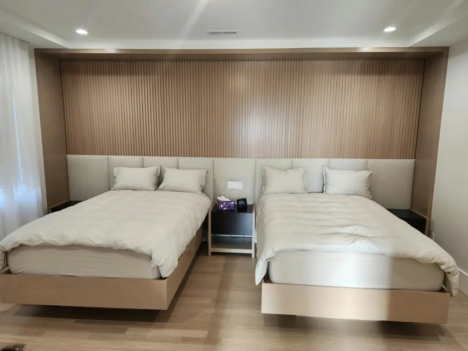 Upholstered headboard wall and beds by Elegant Window Fashion