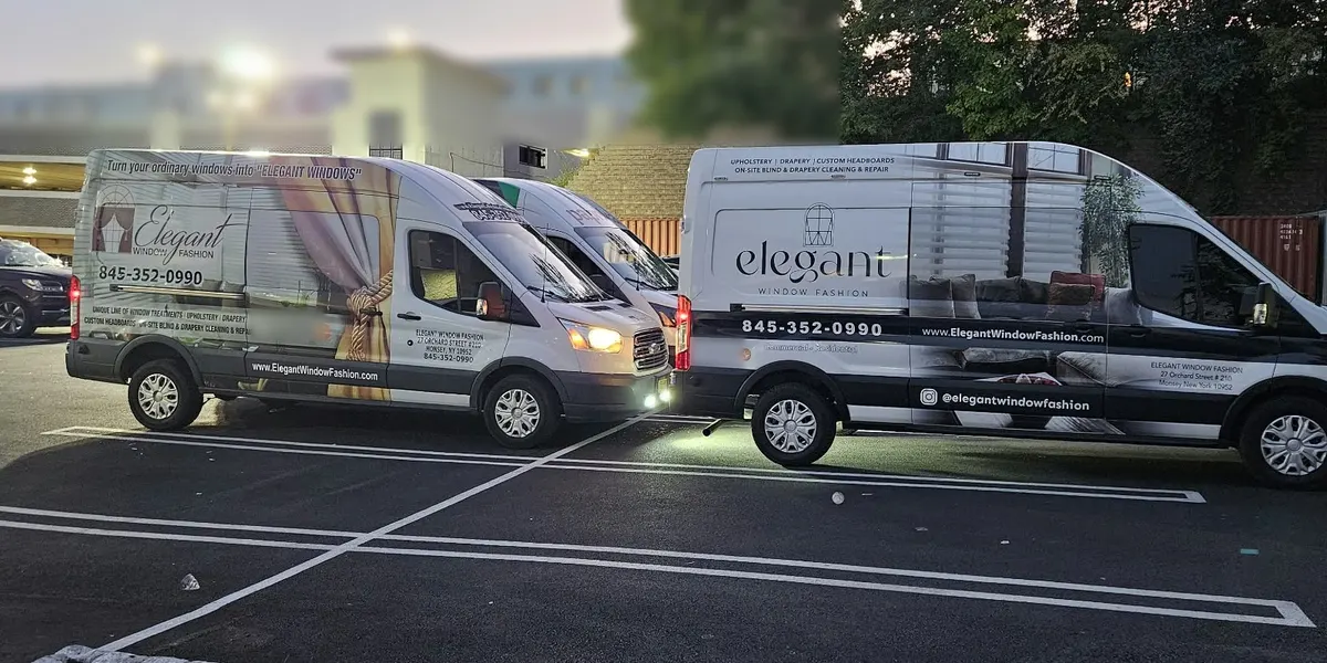 Elegant Window Fashion vans parked together at dusk